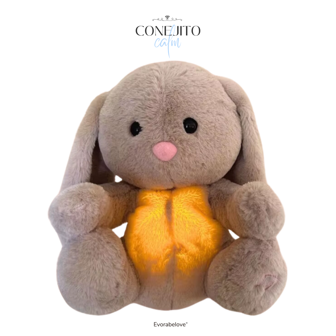 Conejito Calm con latidos y sonidos relajantes. Peluche terapéutico ideal para calmar estrés y ayudar a dormir mejor.